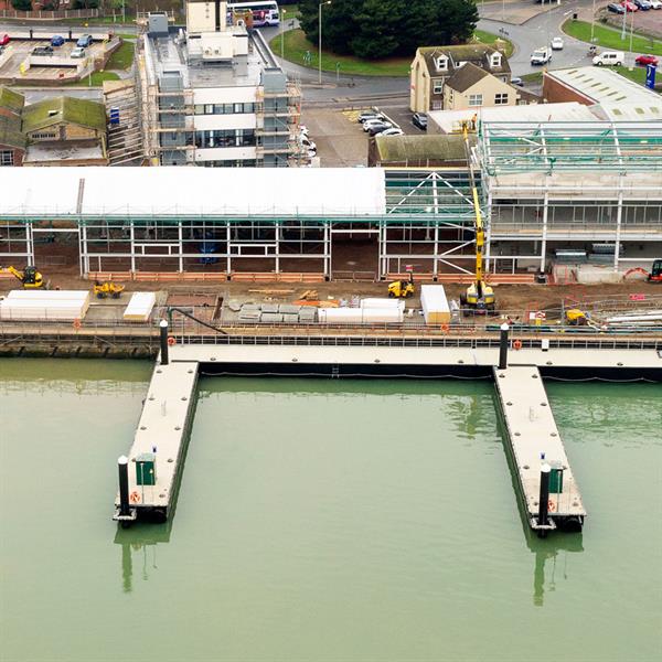 Ultra-heavy pontoons for wind farm support facility