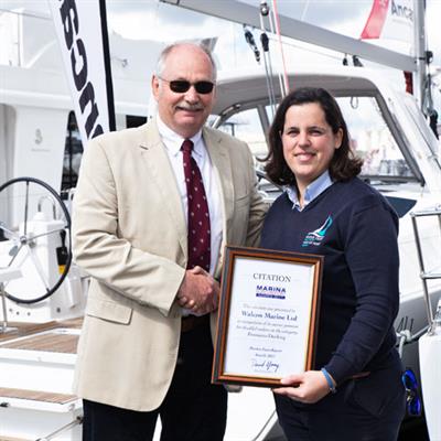 Walcon's Clive Kemp receives the citation from Kerrie Gray at Poole Quay Boat Haven