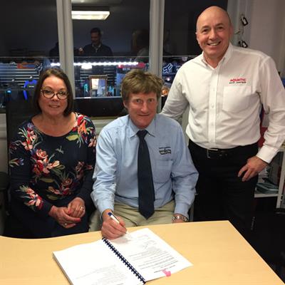 Gill and Graham Armour of Windermere Aquatic flank Walcon MD James Walters as the contract is signed